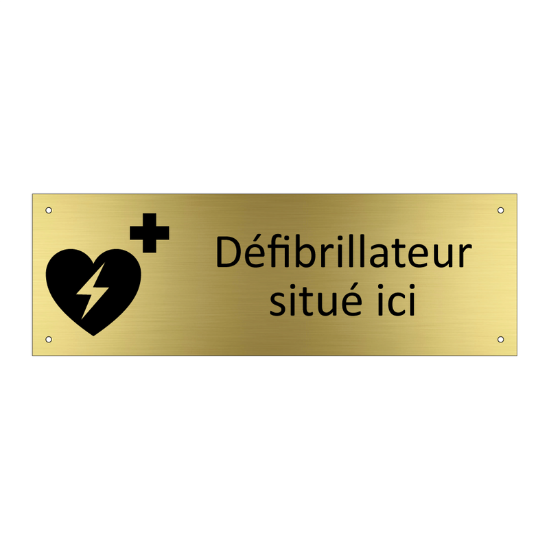 Défibrillateur situé ici