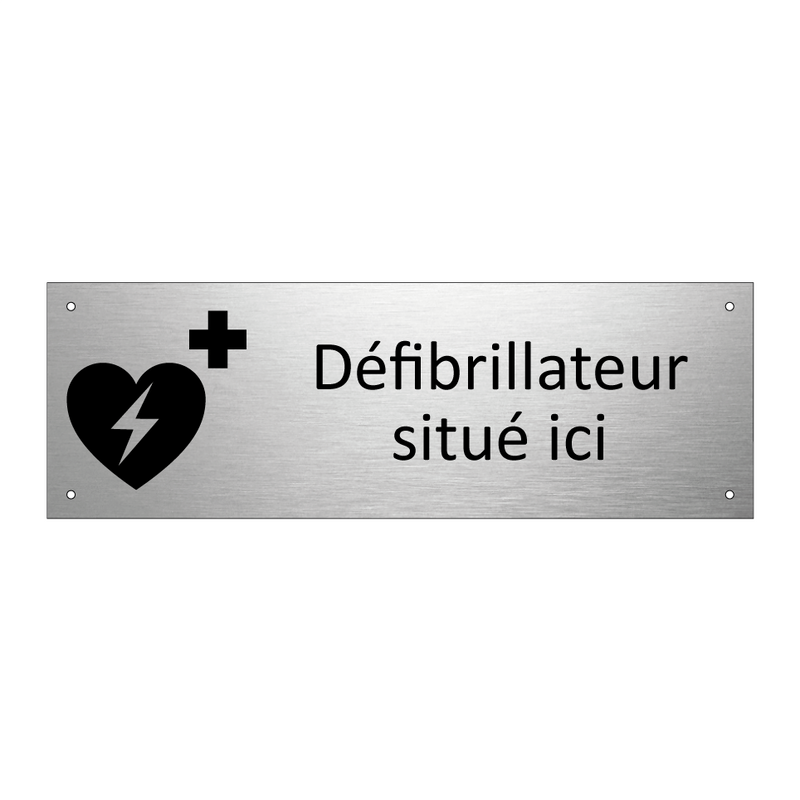 Défibrillateur situé ici