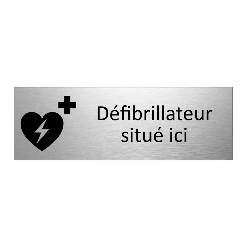 Défibrillateur situé ici