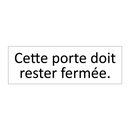 Cette porte doit rester fermée.