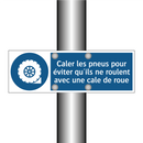 Caler les pneus pour éviter qu'ils ne roulent avec une cale de roue