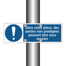Dans cette pièce, des parties non protégées peuvent être sous tension