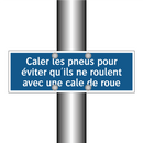 Caler les pneus pour éviter qu'ils ne roulent avec une cale de roue