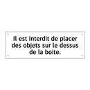 Il est interdit de placer des objets sur le dessus de la boîte.