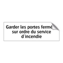 Garder les portes fermées sur ordre du service d'incendie