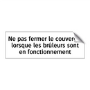 Ne pas fermer le couvercle lorsque les brûleurs sont en fonctionnement