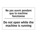 Ne pas ouvrir pendant que la machine  /.../ - Do not open while the machine  /.../