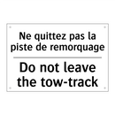 Ne quittez pas la piste de remorquage /.../ - Do not leave the tow-track