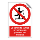 La conduite sur les rayonnages à palettes est interdite.