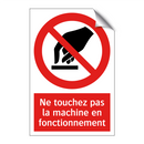 Ne touchez pas la machine en fonctionnement