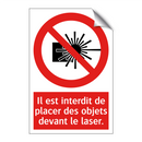 Il est interdit de placer des objets devant le laser.