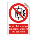 Arrêt. Réparation en cours. Utilisez les escaliers