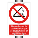 Ne pas fermer le couvercle lorsque les brûleurs sont en fonctionnement