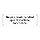 Ne pas ouvrir pendant que la machine fonctionne