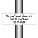 Ne pas ouvrir pendant que la machine fonctionne