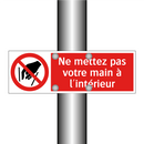 Ne mettez pas votre main à l'intérieur