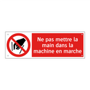 Ne pas mettre la main dans la machine en marche