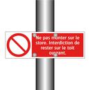 Ne pas monter sur le store. Interdiction de rester sur le toit ouvrant.