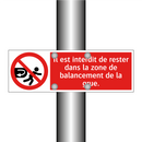 Il est interdit de rester dans la zone de balancement de la grue.