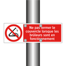 Ne pas fermer le couvercle lorsque les brûleurs sont en fonctionnement