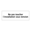 Ne pas toucher l'installation sous tension