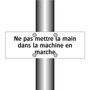 Ne pas mettre la main dans la machine en marche