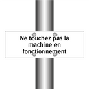 Ne touchez pas la machine en fonctionnement