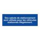 Des sabots de stationnement sont utilisés pour les véhicules stationnés illégalement.