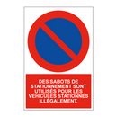 Des sabots de stationnement sont utilisés pour les véhicules stationnés illégalement.