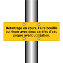 Détartrage en cours. Faire bouillir ou rincer avec deux carafes d'eau propre avant utilisation