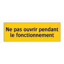 Ne pas ouvrir pendant le fonctionnement