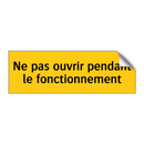Ne pas ouvrir pendant le fonctionnement