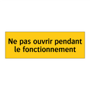Ne pas ouvrir pendant le fonctionnement
