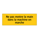 Ne pas mettre la main dans la machine en marche