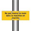 Ne pas mettre la main dans la machine en marche