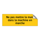 Ne pas mettre la main dans la machine en marche