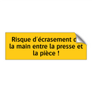 Risque d'écrasement de la main entre la presse et la pièce !