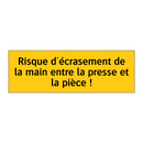 Risque d'écrasement de la main entre la presse et la pièce !
