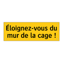 Éloignez-vous du mur de la cage !