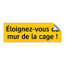 Éloignez-vous du mur de la cage !