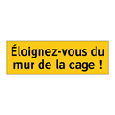 Éloignez-vous du mur de la cage !