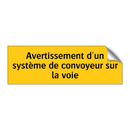 Avertissement d'un système de convoyeur sur la voie