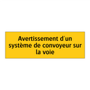 Avertissement d'un système de convoyeur sur la voie