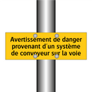 Avertissement de danger provenant d'un système de convoyeur sur la voie