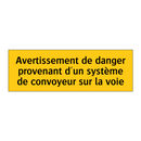 Avertissement de danger provenant d'un système de convoyeur sur la voie