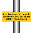 Avertissement de risque de coincement dû à des objets rotatifs non protégés