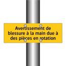 Avertissement de blessure à la main due à des pièces en rotation