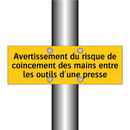 Avertissement du risque de coincement des mains entre les outils d'une presse