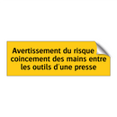 Avertissement du risque de coincement des mains entre les outils d'une presse