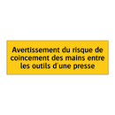 Avertissement du risque de coincement des mains entre les outils d'une presse